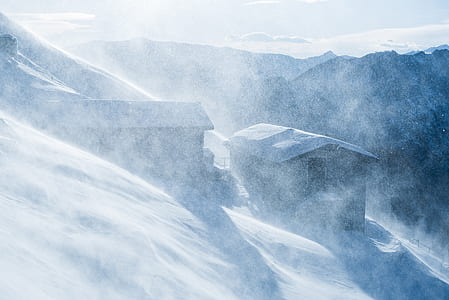 brown house near mountains during daytime thumbnail