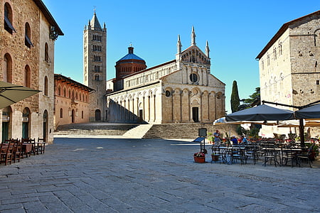 gray and brown cathedral under blue clear sky during daytime thumbnail