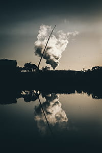 grayscale photography of smoke across body of water thumbnail