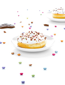 pastries with chocolate toppings on ceramic plate thumbnail