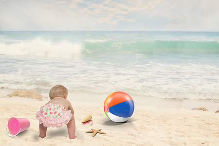 edited photo of baby on beach during daytime thumbnail