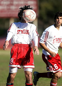 man wearing white and red adidas St. Thomas jersey with red and white football thumbnail