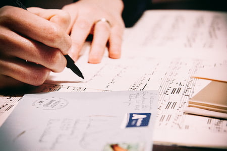 person writing musical notes thumbnail