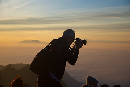 silhouette of man using camera thumbnail