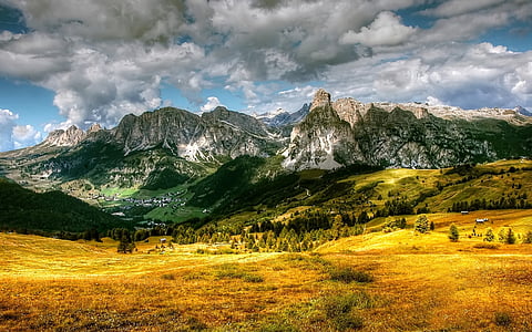 green valley under white and blue sky thumbnail