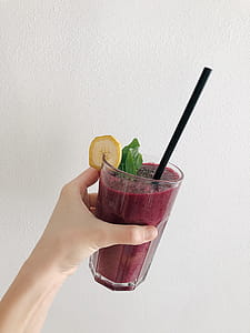 Person's Holding Fruit Drink thumbnail