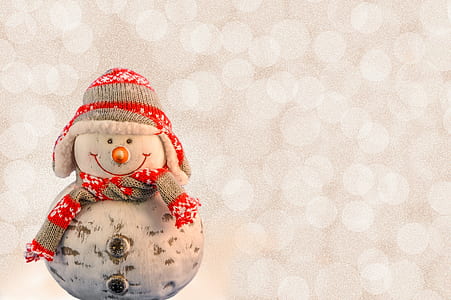 white and red snowman wearing knit hat and scarf figurine thumbnail