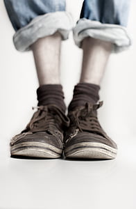 person wearing brown shoes in tilt shift photography thumbnail