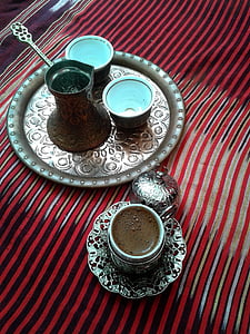 cup of coffee and container on table thumbnail