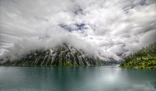 mountains covered with white clouds during daytime thumbnail