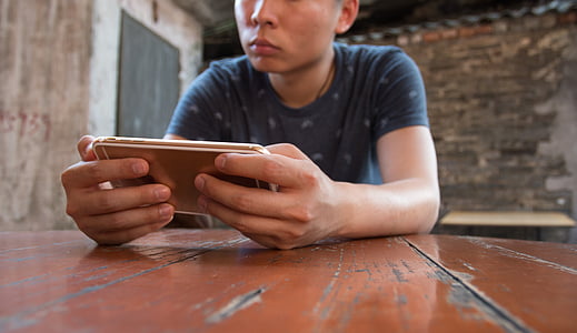 man holding phone thumbnail
