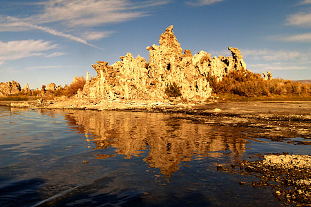 landscape photography of a mountain and body of water thumbnail