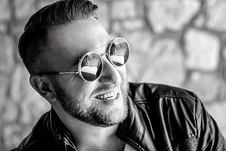 man wearing round sunglasses with silver-colored frame thumbnail