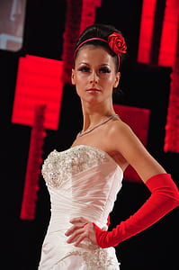 woman in white dress and red gloves thumbnail