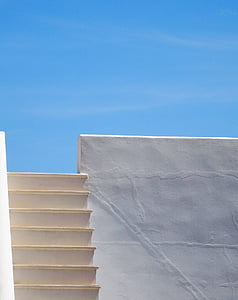 white concrete stairs beside white wall thumbnail