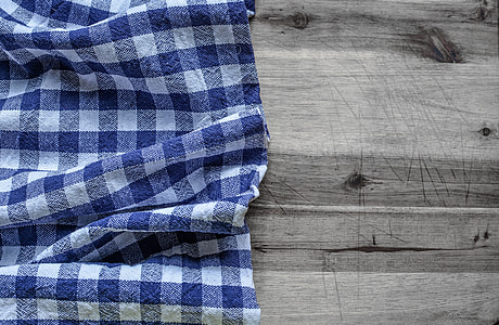 blue and white textile on gray wooden surface thumbnail