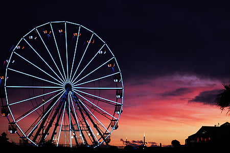 lighted ferris wheel during golden hour thumbnail