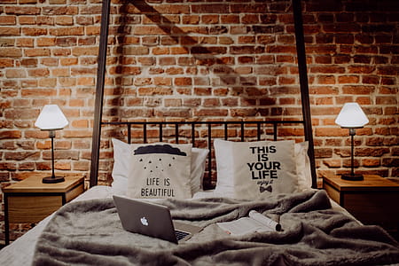 Enjoying evening with a Macbook in a nice bed thumbnail