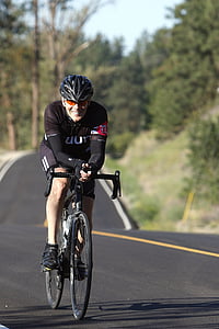 man riding bicycle on road thumbnail