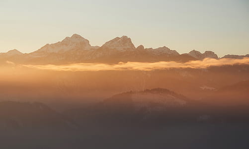 aerial photography of snow-capped mountains at sunset thumbnail
