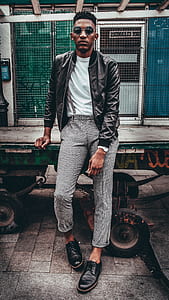 man in black leather jacket wearing sunglasses thumbnail