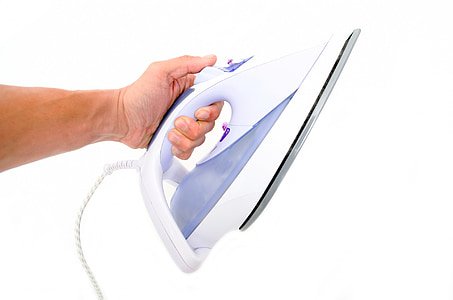 person holding white steam iron thumbnail