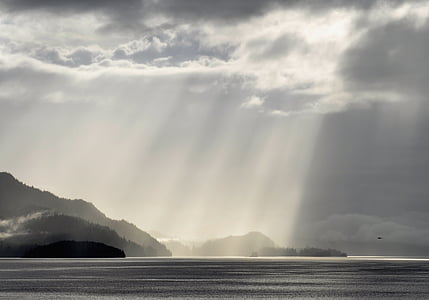 grey scale photography of sun rays thumbnail