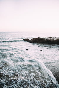 landscape photography of sea and mountain thumbnail