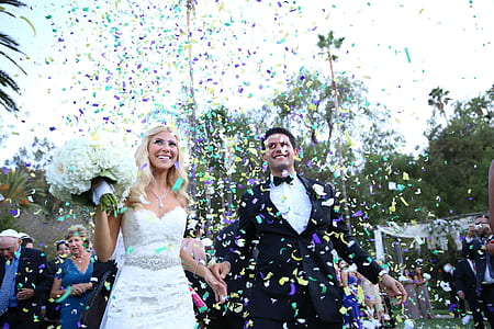 man and woman holding hands under confetti thumbnail
