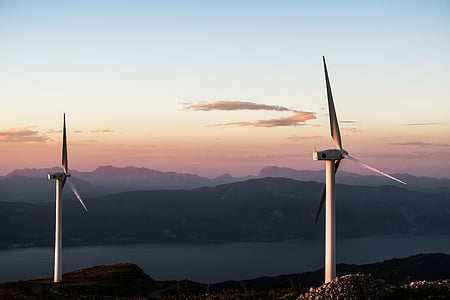 two white wind turbines during daytime thumbnail