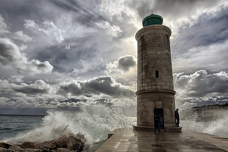 man leaning on lighthouse thumbnail