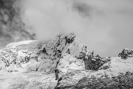 grayscale photography of snow-covered mountains during winter thumbnail