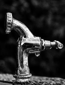 Grayscale Photo Of Stainless Steel Faucet thumbnail