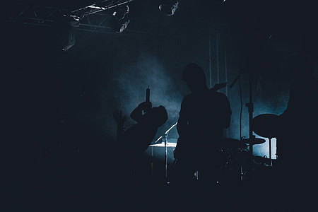 silhoutte of men playing musical instruments thumbnail