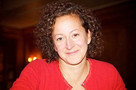 woman smiling in dim room thumbnail