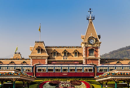 photo of brown and red building with clock tower thumbnail