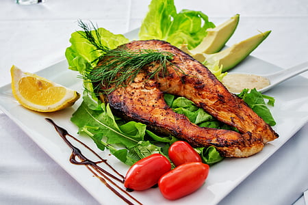 roasted fish meat on white plate thumbnail
