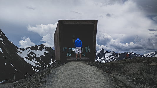 man standing in front of box thumbnail