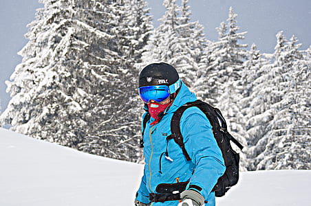 man standing on snow-covered mountain slope thumbnail