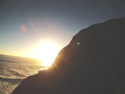 silhouette of mountain slope during golden hour thumbnail
