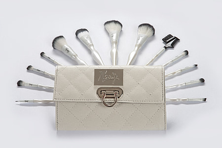 white make-up brush lot and quilted white wallet thumbnail
