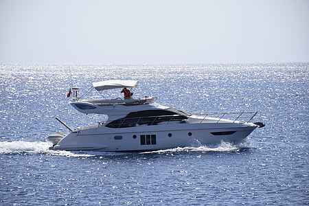 white and black yacht in body of water at daytime thumbnail