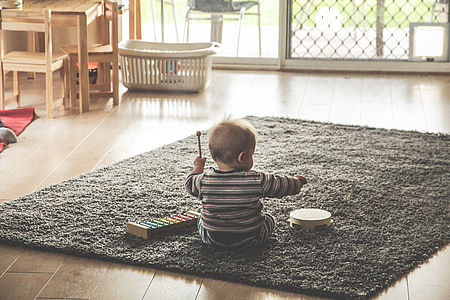 baby playing with instruments thumbnail