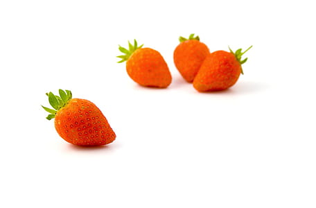 four strawberries on white surface thumbnail