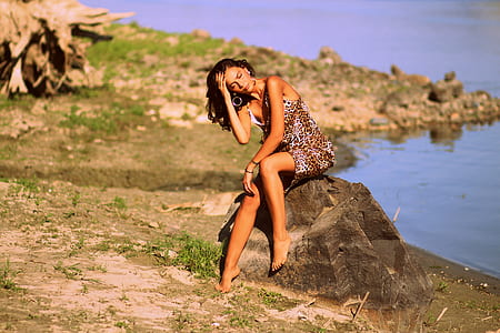woman wears brown and white leopard print sleeeveless dress thumbnail