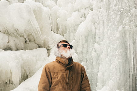 man smoking against ice wall thumbnail