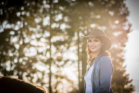 woman wearing cowboy hat thumbnail