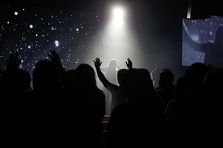silhouette of peoples watching musical band during nighttime thumbnail