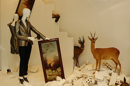 two brown deer taxidermies beside brown deer painting thumbnail