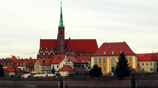 red painted buildings beside pointed infrastructure thumbnail